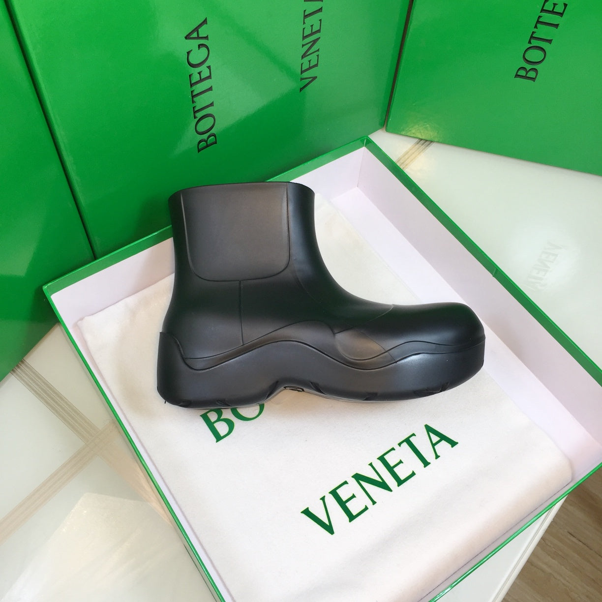 BOTTEGA VENETA PUDDLE ANKLE BOOT IN BLACK RUBBER